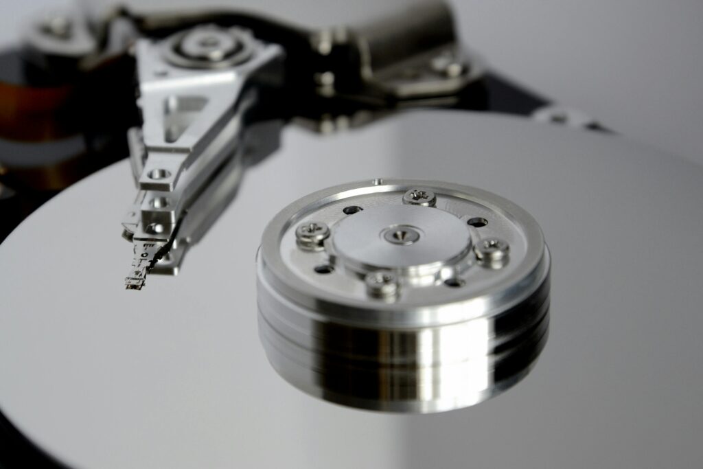 Detailed view of hard drive mechanism showcasing metallic precision parts.